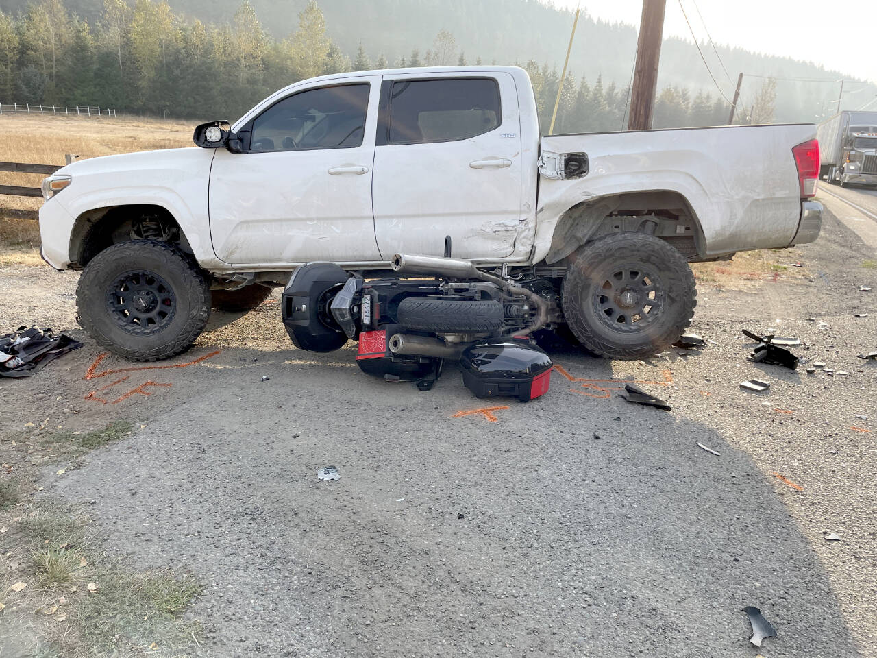 A Yamaha motorcycle and a Toyota Tacoma truck were involved in a collision Friday on state Highway 19. (Paula Hunt/Peninsula Daily News)