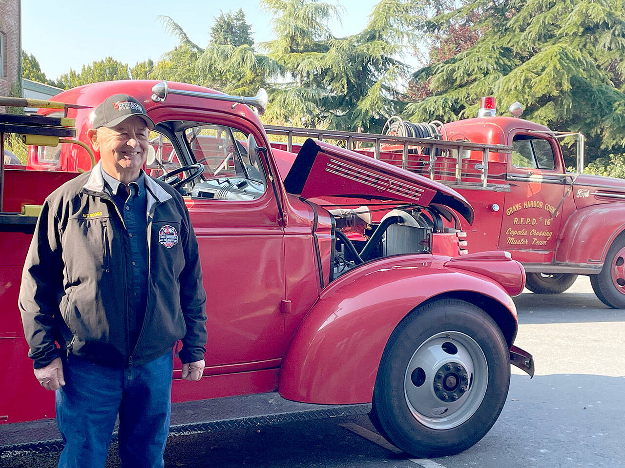 Chuck Boggs began his career as a firefighter in 1971 and retired as assistant chief of East Jefferson Fire and Rescue in 2010. Boggs attended the 150th anniversary celebration of the department Saturday at Port Townsend City Hall where vintage fire engines were on display. (Paula Hunt/Peninsula Daily News)