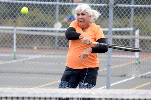 Martha Olbrych of Port Ludlow is part of the tennis crew at the Port Townsend High School courts on Wednesdays and Sundays. Players of various levels are getting together for morning doubles as long as the weather stays tennis-friendly. Anyone interested in joining the group can contact organizer David Michael at harp@olympus.net. (Diane Urbani de la Paz/for Peninsula Daily News)