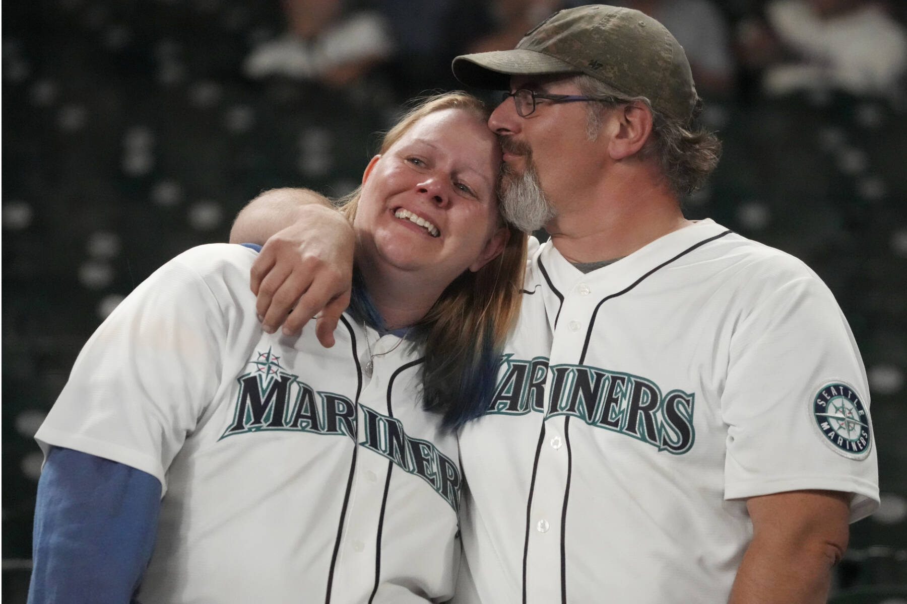 Seattle Mariners fans react after the Seattle Mariners lost to the Houston Astros in Game 3 of an American League Division Series baseball game Saturday, Oct. 15, 2022, in Seattle. (AP Photo/Ted S. Warren)