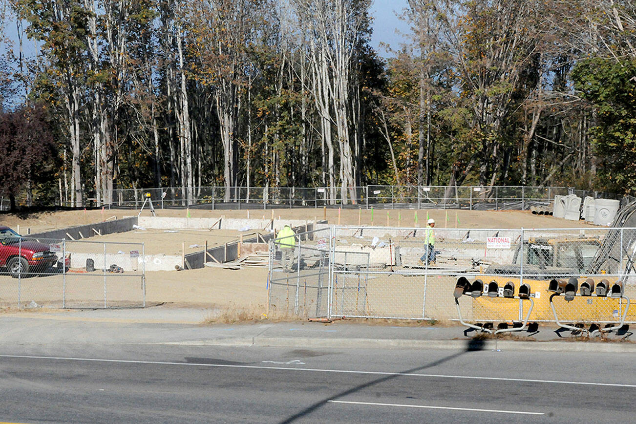Foundation work for a new Starbucks and Mod Pizza restaurant continues near U.S. Highway 101 and Del Guzzi Drive in Port Angeles. (Keith Thorpe/Peninsula Daily News)