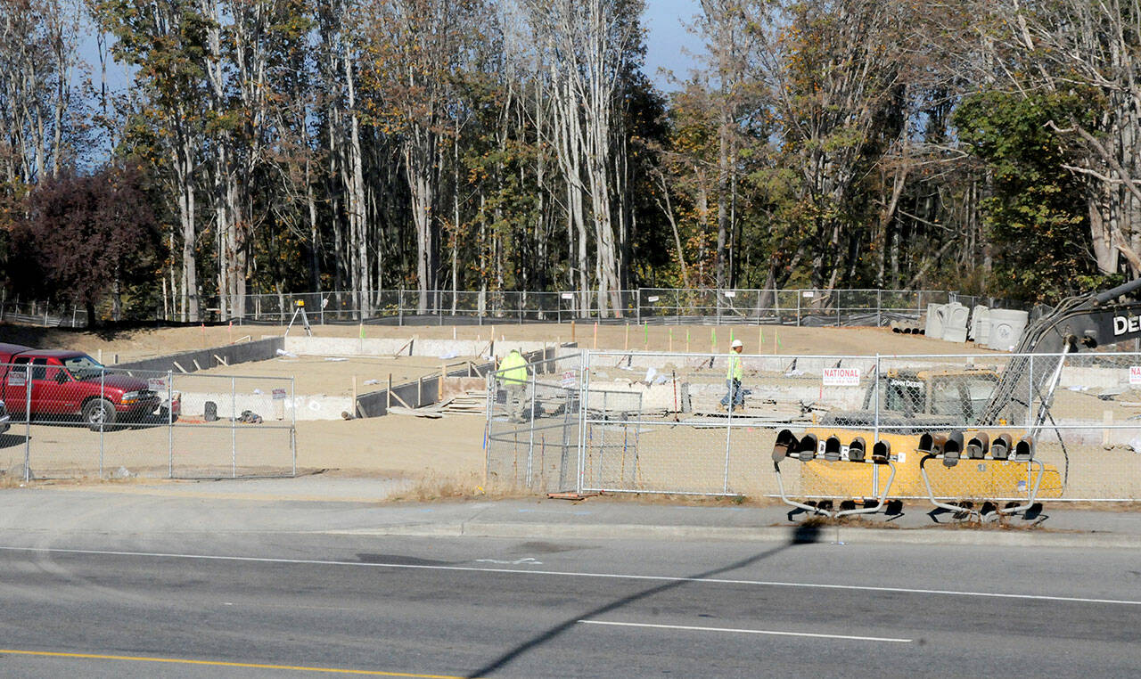 Foundation work for a new Starbucks and Mod Pizza restaurant continues near U.S. Highway 101 and Del Guzzi Drive in Port Angeles. (Keith Thorpe/Peninsula Daily News)