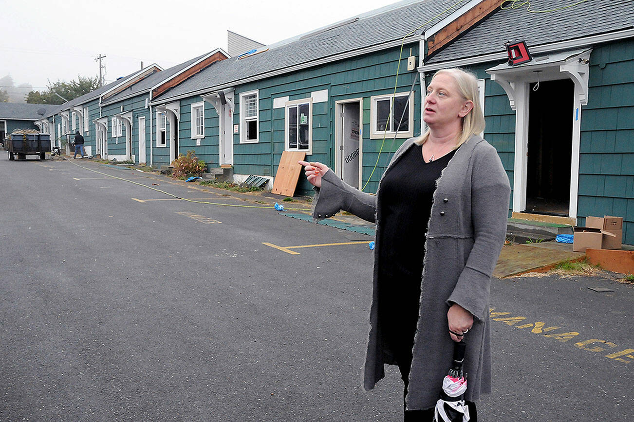 Wendy Sisk, chief executive officer for Peninsula Behavioral Health, talks about the conversion of the former All-View Motel in Port Angeles into the future Dawn View Apartments for low-income individuals and families. (Keith Thorpe/Peninsula Daily News)