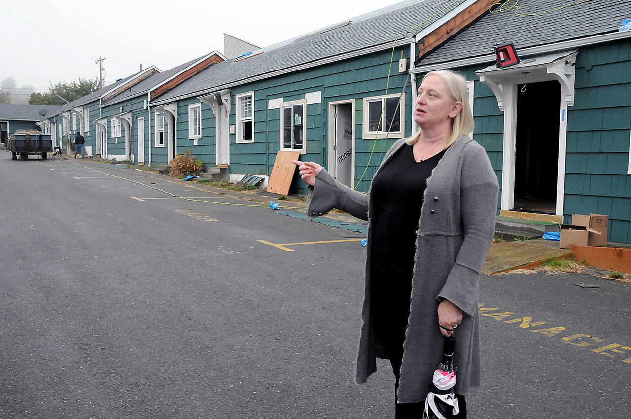 Wendy Sisk, chief executive officer for Peninsula Behavioral Health, talks about the conversion of the former All-View Motel in Port Angeles into the future Dawn View Apartments for low-income individuals and families. (Keith Thorpe/Peninsula Daily News)