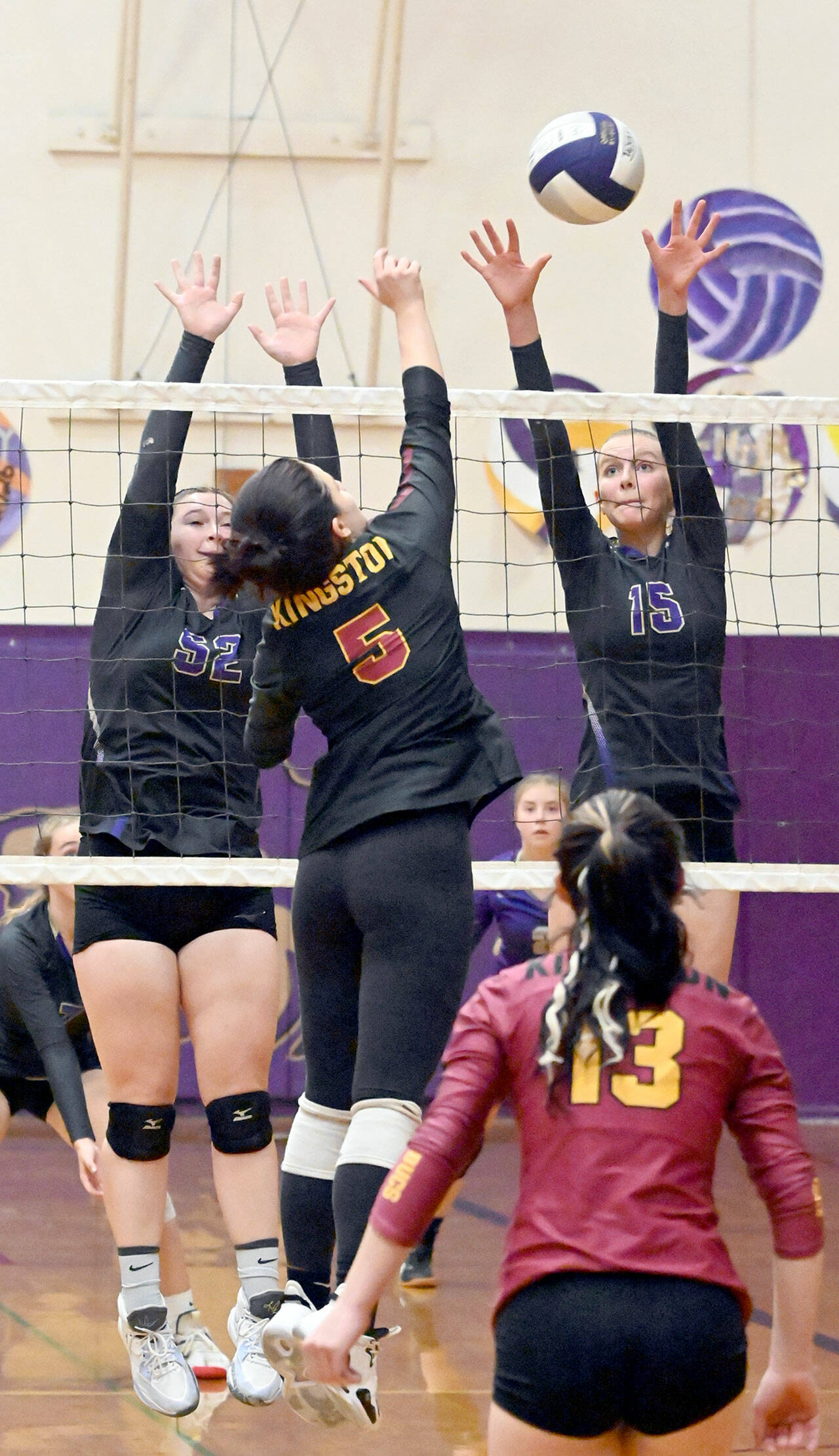 Michael Dashiell/Olympic Peninsula News Group
Sequim’s Sammie Bacon, left, and Kendall Hastings attempt to defend against a shot by Kingston’s Grace Mosco as Kingston libero Lily Wright looks on during the Wolves 3-0 senior night victory on Thursday.