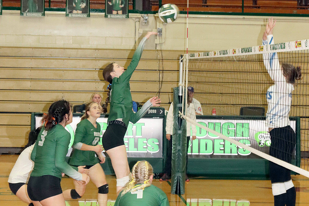 Dave Logan/for Peninsula Daily News
Ava Hairell tips the volleyball back over the net in their match Monday against North Mason. In on the play is Alaina Baublitz (4), Josephine Edgington (3) and is Lily Halberg (12).