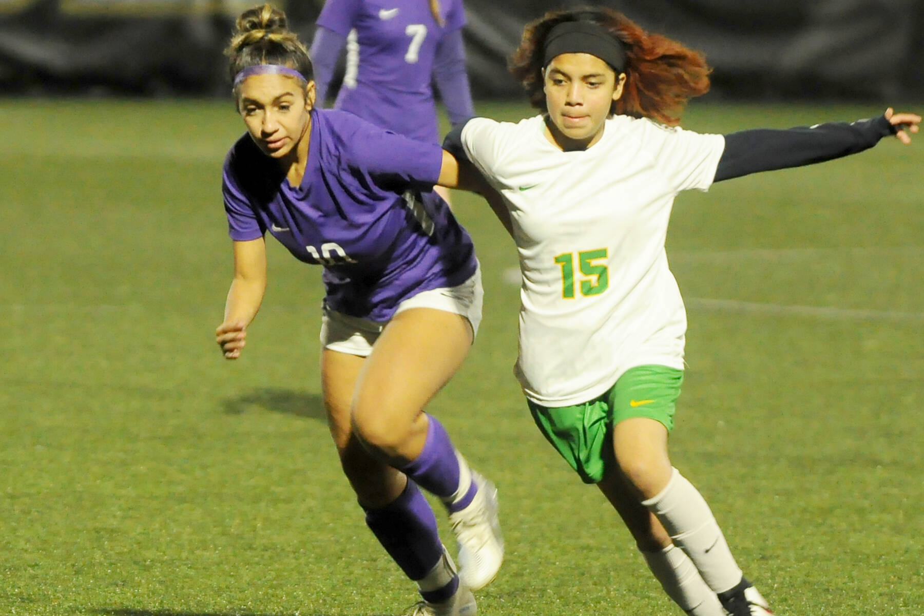 Sequim’s Jennyfer Gomez, left, battles with a Clover Park midfielder in the Wolves’ 2-0 win in the West Central District tourney opener Tuesday at Wally Sigmar Field at Peninsula College. In the background is Sequim’s Eve Breithaupt (7). (Michael Dashiell/Olympic Peninsula News Group)