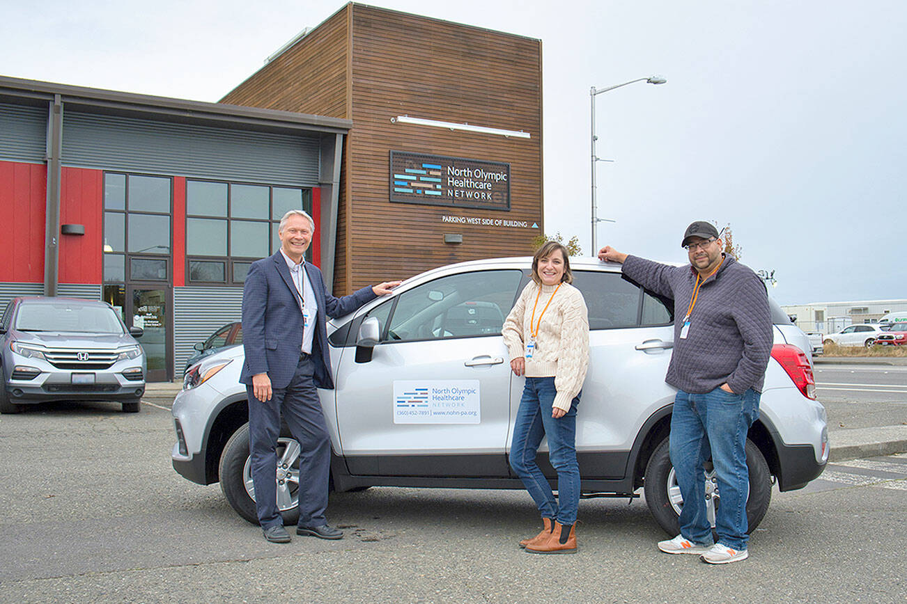 North Olympic Healthcare Network 

Posing with a new Chevy Trax to be used for community outreach are, from left, CEO Michael Maxwell, MD; Community Health Worker Lauryn Garrett; and Outreach and Navigation Manager Carlos Osorio.