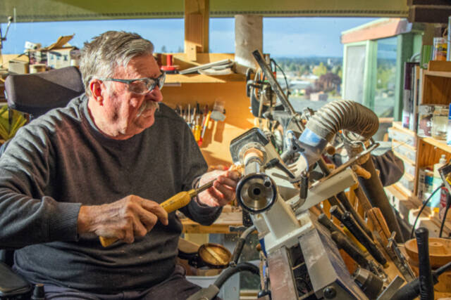 Emily Matthiessen / Olympic Peninsula News Group
Sequim resident Dave Sellman, five-year member of the Strait Turners, works at a lathe that he set up at an angle so that he could turn wood in his wheelchair. He says that wood turning is accessible for many people who have physical restrictions or space restrictions. His shop is small but contains all the equipment he needs to turn out beautiful pieces that he gives to his loved ones or sells at Shipley Center events, donating all proceeds to charity, especially the VOHCC. He says, "I hope that other wheelchair bound individuals will realize that they can be creative and stretch their boundaries."