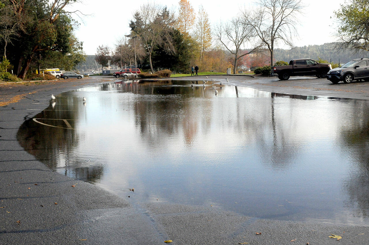 A gigantic puddle covers much of the south parking lot at John Wayne Marina in Sequim on Saturday morning, the result of heavy rains from an autumn storm. (Keith Thorpe/Peninsula Daily News)