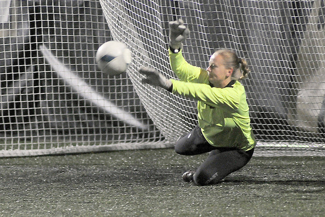 KEITH THORPE/PENINSULA DAILY NEWS
Peninsula goalkeeper Frida Markstrom fends off shot during a penalty shootout to determine a winner of Saturday's NWAC semifinal game against Spokane at Peninsula College in Port Angeles.