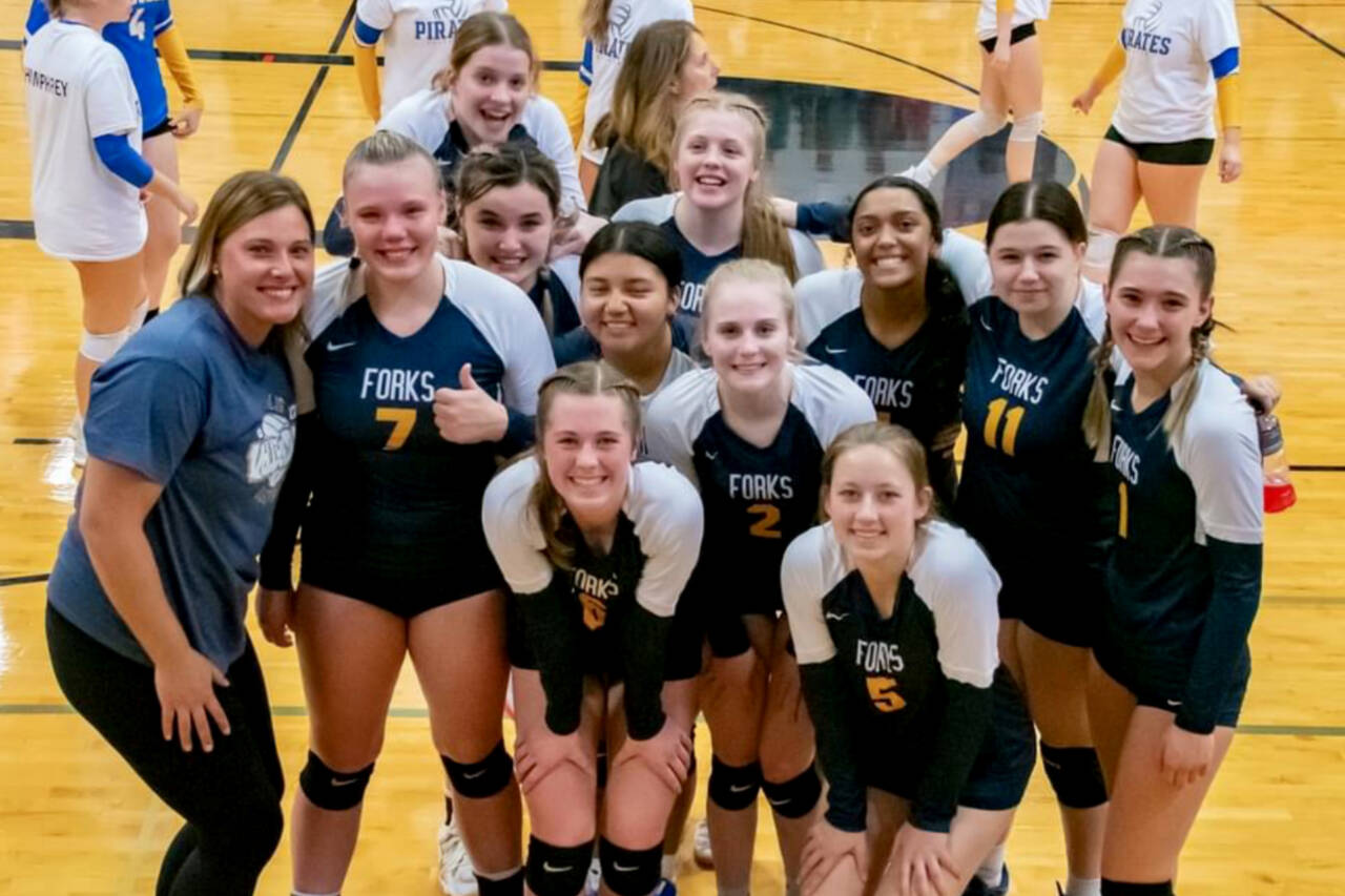 The Forks volleyball team celebrates Saturday in Raymond qualifying for the state 2B tournament, the Spartans’ first trip to state since 2003. (Photo courtesy of Kim Weissenfels)