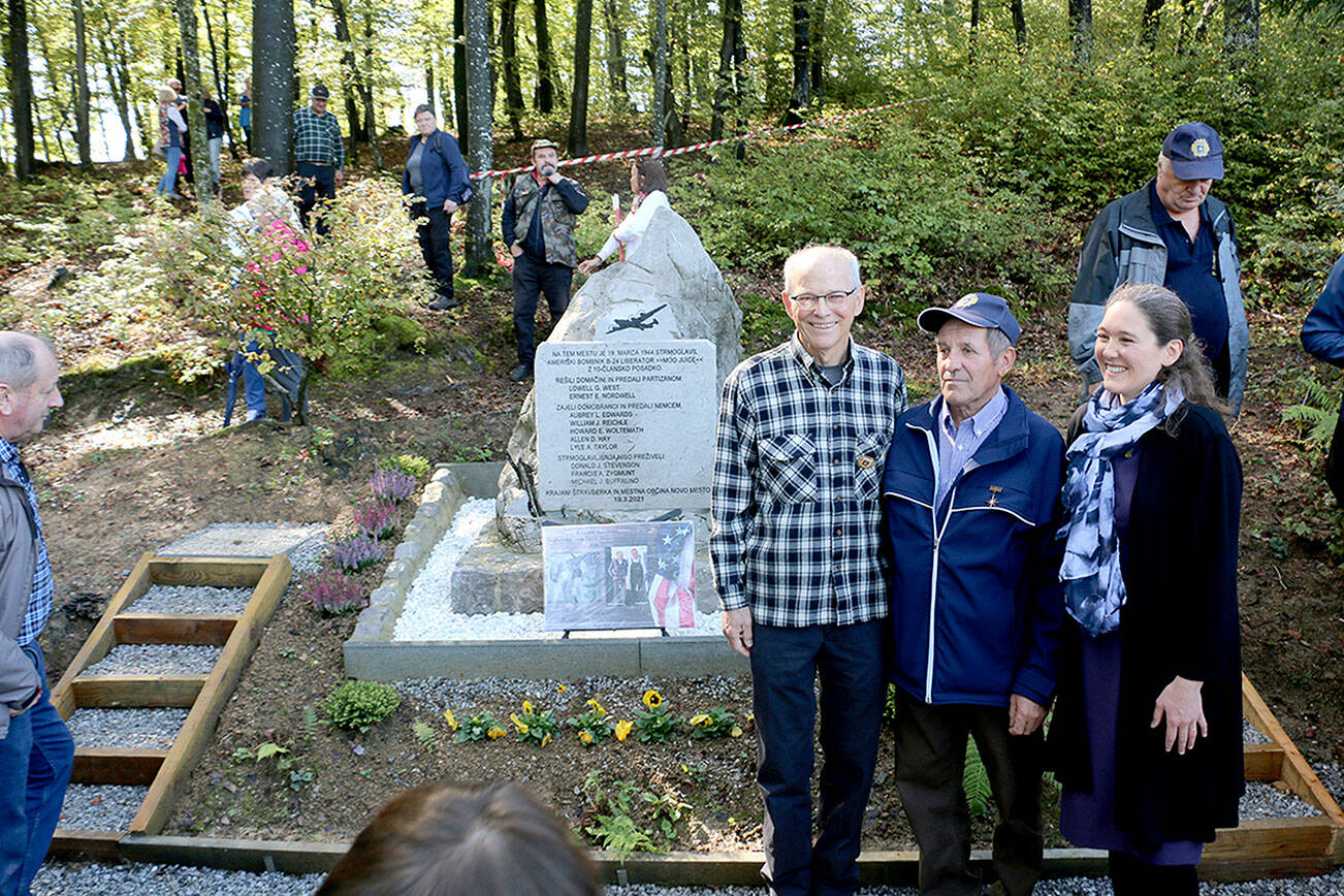 Steve Nordwell and his daughter Hillary stand with Anton Blasic at the site of the memorial in Stravberk, Slovenia, where Nordwell’s father’s plane went down during World War II. (Steve Nordwell)