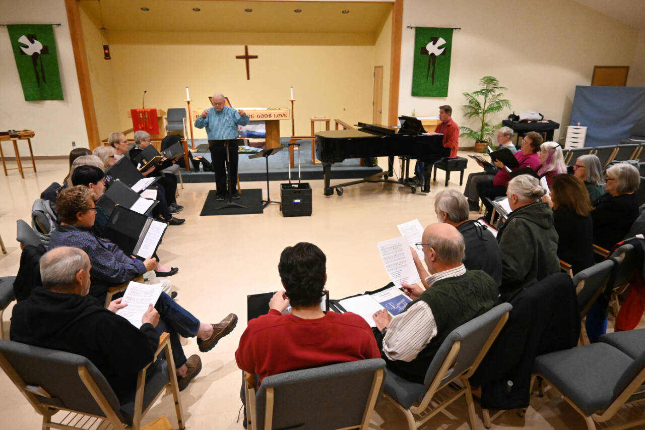 Led by conductor Jerome Wright and accompanied by Mark Johnson, the Peninsula Singers last week rehearse for upcoming fall concert dates at Dungeness Valley Lutheran Church. (Michael Dashiell/Olympic Peninsula News Group)