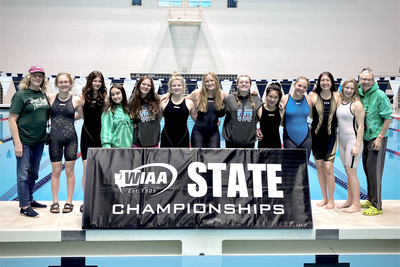 The Port Angeles girls swim team finished fifth at the state swim and dive championships, the teams highest finish since 2017. From left are assistant coach Lisa Walls, Mackenzie DuBois, Rachel Cooper, Lucia Garcia-Pulido, Lynzee Reid, Brooke St. Luise, Harper McGuire, Grace Possinger, Yau Fu, Lizzy Shaw, Danika Asgeirsson, Sara Wilson and coach Sally Cole. (Courtesy photo)