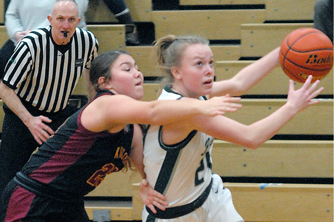 Keith Thorpe/Peninsula Daily News
Port Angeles' Anna Petty, right, evades the defense of Kingston's Jayla Moon on Thursday in Port Angeles.
