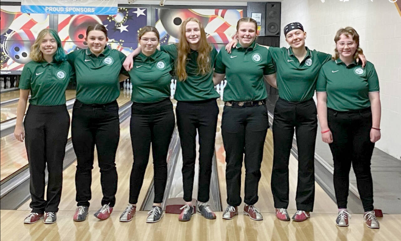 The fledging Port Angeles girls bowling team celebrates its first match, a win over Olympic, on Monday. From left are team members Zoey Van Gordon, Abby Rudd, Izzy Spencer, Kenadie Ring, Taylor Worthington, Violet Mills and Sophie Constant. (Courtesy photo)