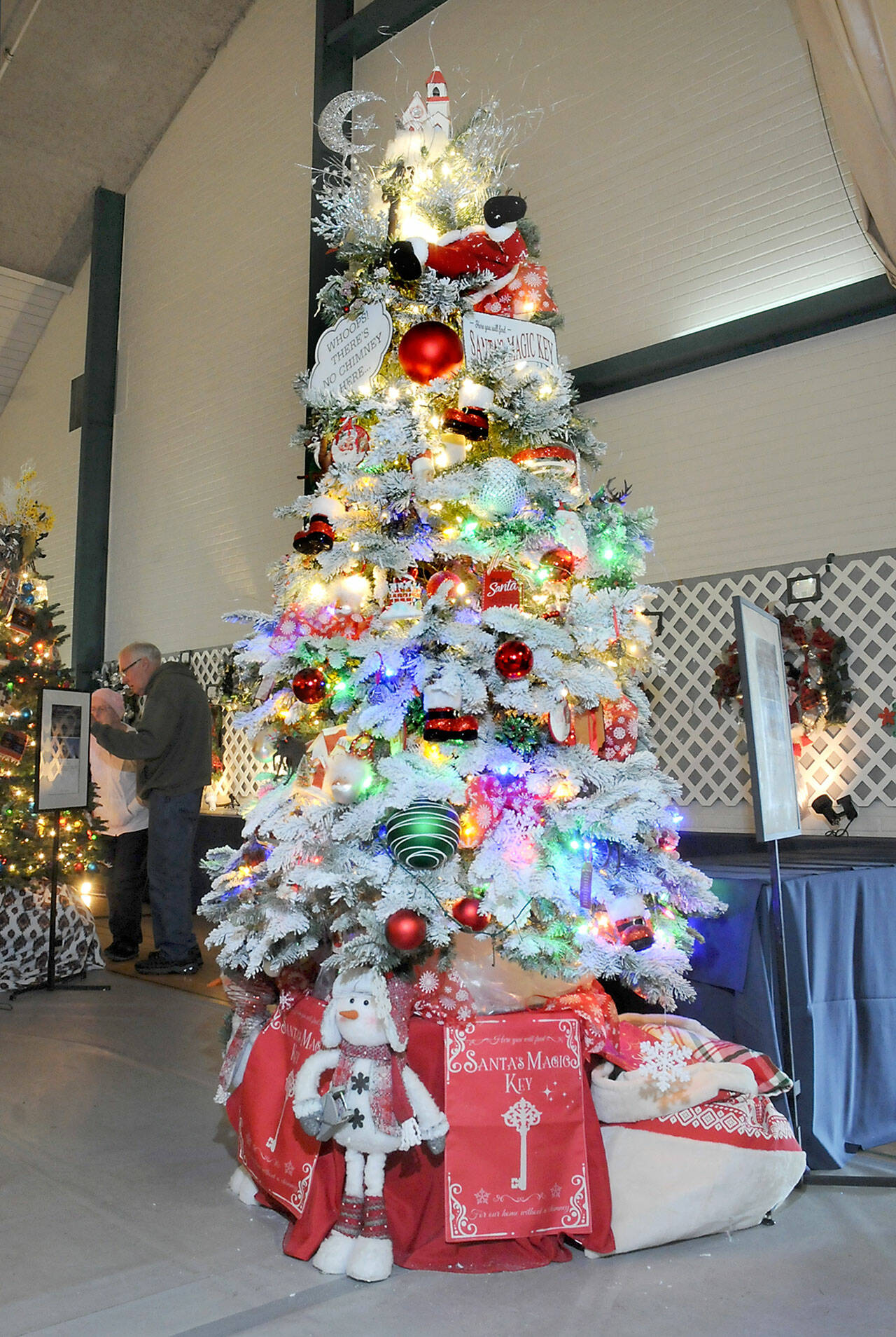 A Christmas tree titled “Santa’s Magic Key” stands tall at the 32nd annual Festival of Trees at Vern Burton Community Center in Port Angeles on Friday after it fetched the highest bid during Friday night’s gala auction benefiting the Olympic Medical Center Foundation. (Keith Thorpe/Peninsula Daily News)