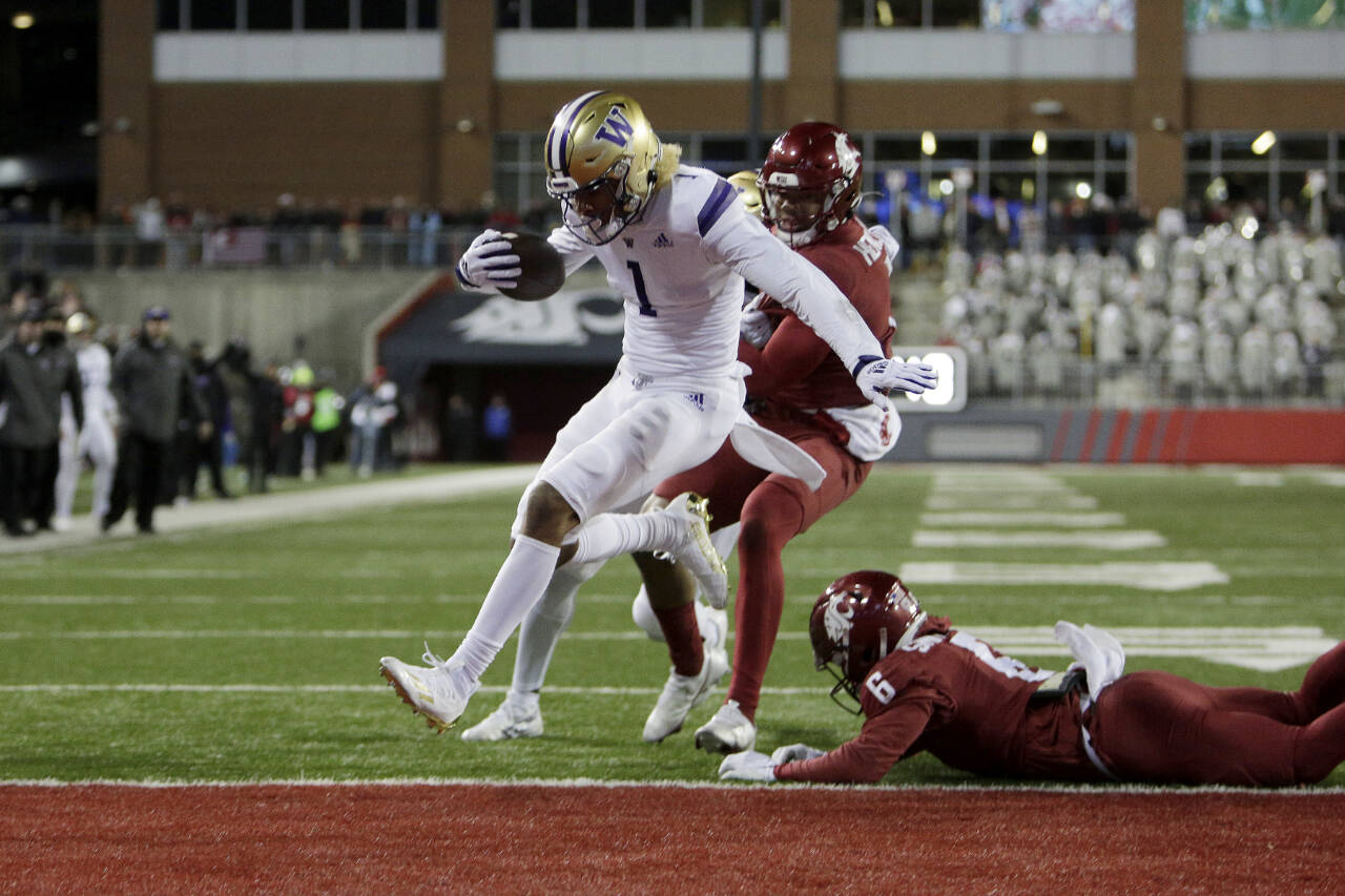 Washington wide receiver Rome Odunze (1) runs for a touchdown during the second half of an NCAA college football game against Washington State, Saturday, Nov. 26, 2022, in Pullman, Wash. Washington won 51-33. (AP Photo/Young Kwak)
