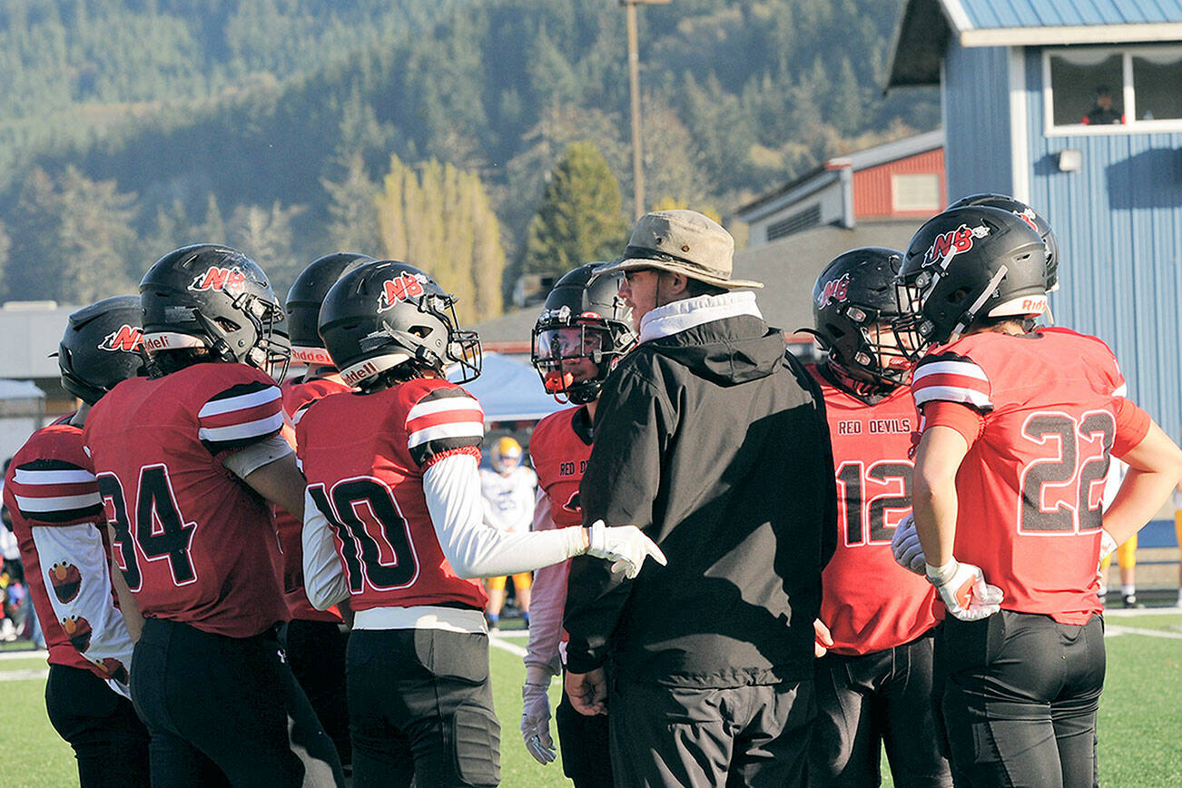 Lonnie Archibald/for Peninsula Daily News
Neah Bay head coach Kane Bachelor instructs his players during the Red Devils' 66-14 state quarterfinal win over Wellpinit. 
Neah Bay faces Liberty Bell for the 1B state championship at noon Saturday at Mount Tahoma High School.