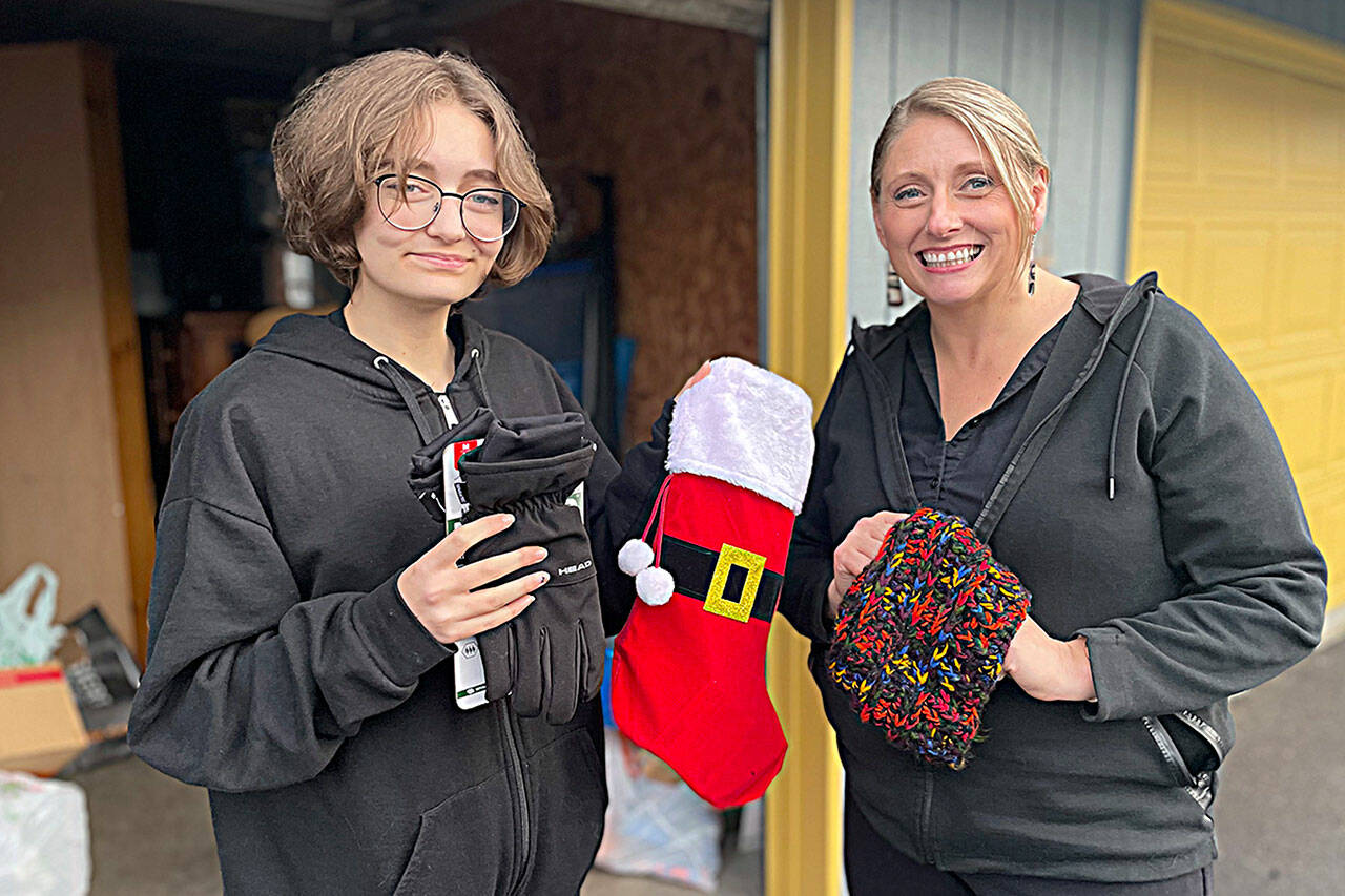 For the second year, River Jensen, left, and her mom Anna Larsen plan to use stockings for River’s Christmas Project to supply toiletries to local homeless people and others in crisis. River, now 16, started the project seven years ago. (Matthew Nash/Olympic Peninsula News Group)