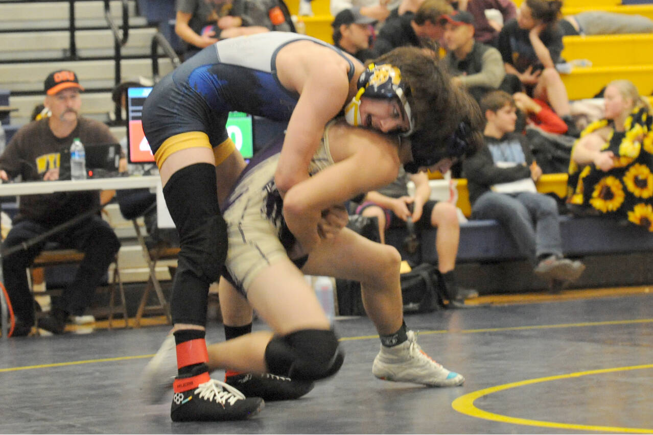 Lonnie Archibald/for Peninsula Daily News
Forks Matthew Montes wrestles Cayden Beauregard of Sequim in the Forks Invitational held Saturday. Montes won his match and his 113-pound weight division.