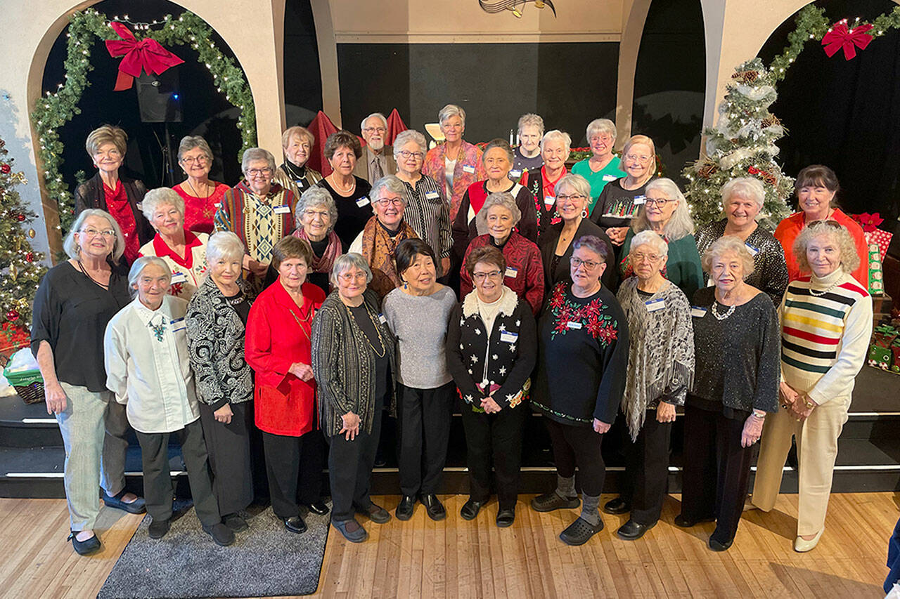 Volunteers with the Sequim Dungeness Hospital Guild gather for a photo during their volunteer appreciation luncheon in Olympic Theatre Arts. It was their first event honoring volunteers since 2017. (Matthew Nash/Olympic Peninsula News Group)