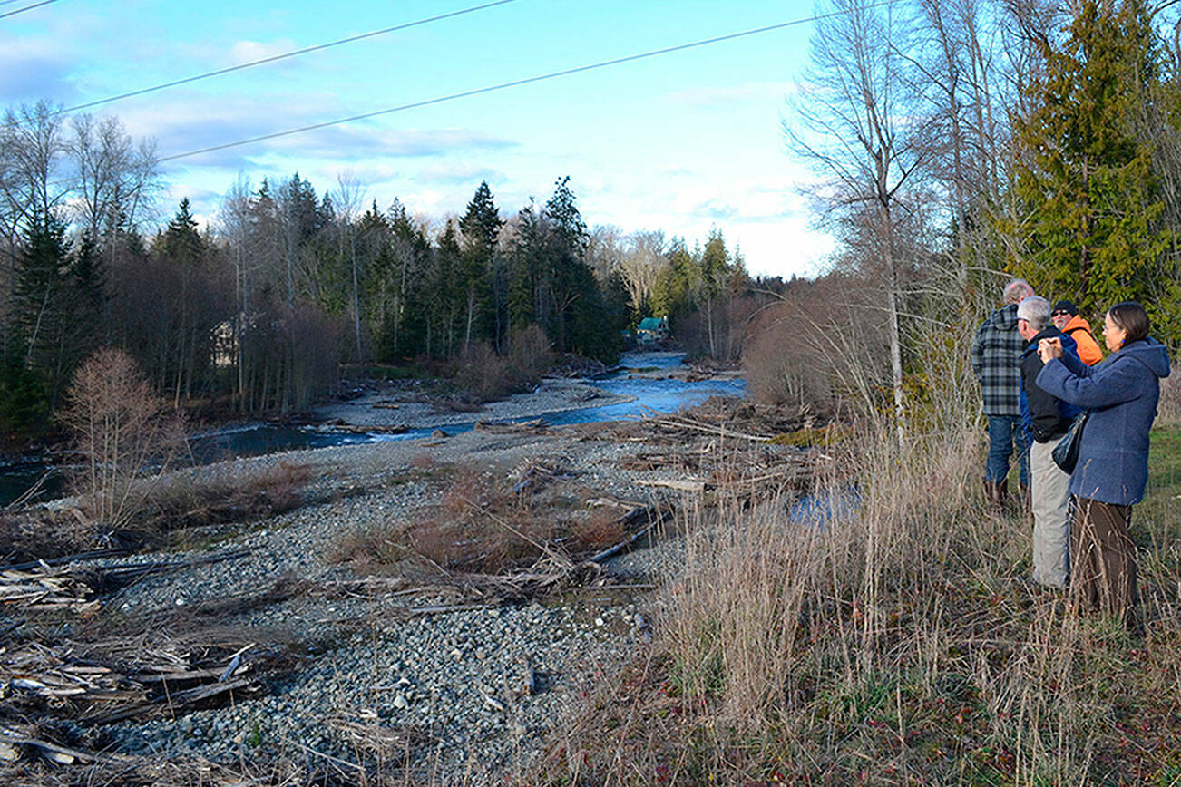 Matthew Nash/Olympic Peninsula News Group

Visitors look at the Dungeness River near the site in 2017 where Clallam County officials continue to seek support for the Dungeness Off-Channel Reservoir.
