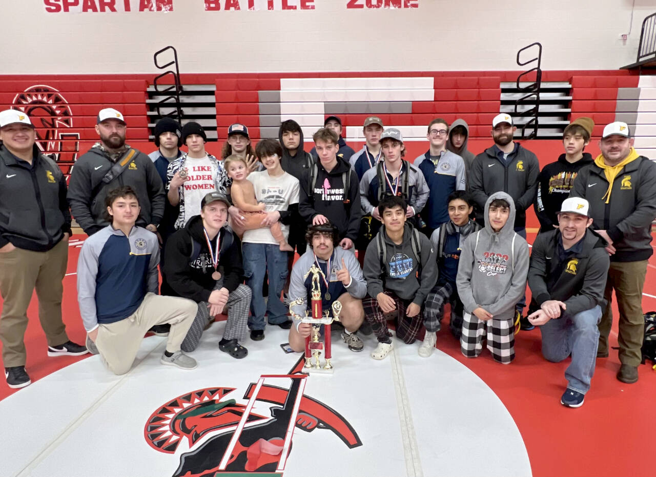 The Forks boys wrestling team celebrates winning the Tony Saldivar Ironman tournament held in Granger this weekend. Forks beat out 18 other teams to win the team title with Sloan Tumaua and Matthew Montes winning their weight divisions. (Photo courtesy of Forks Wrestling)