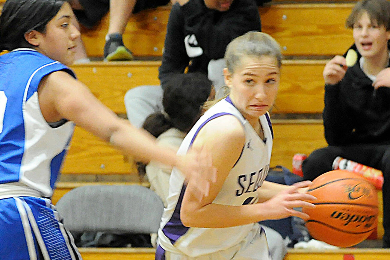 Matthew Nash/Olympic Peninsula News Group
Sequim's Tary Johnson, right, looks to get past North Mason's Felicity Fowler in a 53-27 home win over North Mason on Dec. 15. Johnson had four points, three rebounds and two assists against the Bulldogs.