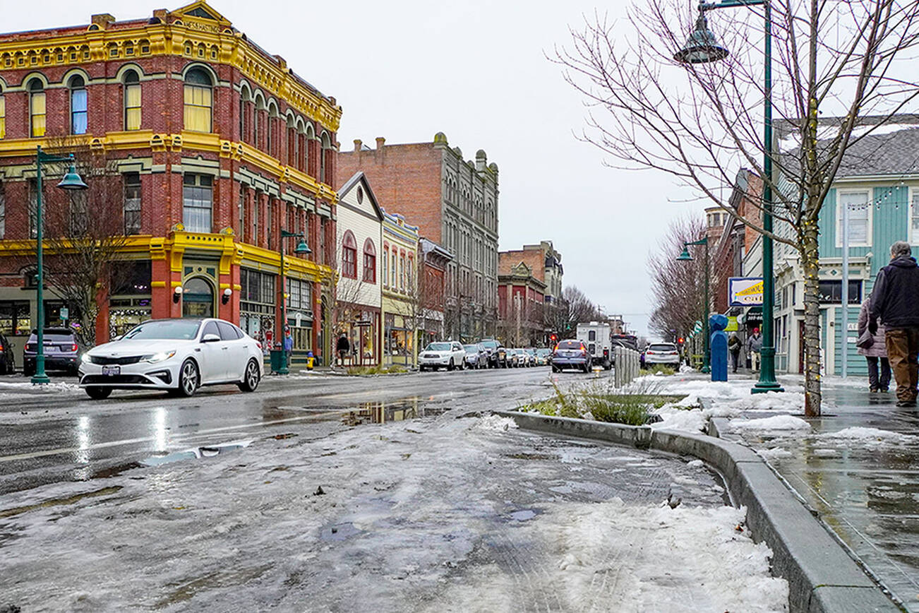 Steve Mullensky/for Peninsula Daily News

After days of frozen streets and sidewalks the downtown Port Townsend business district is covered with slush and puddles after an overnight rain on Thursday and Friday morning. The temperature climbed to 37 degrees at mid-day Friday.