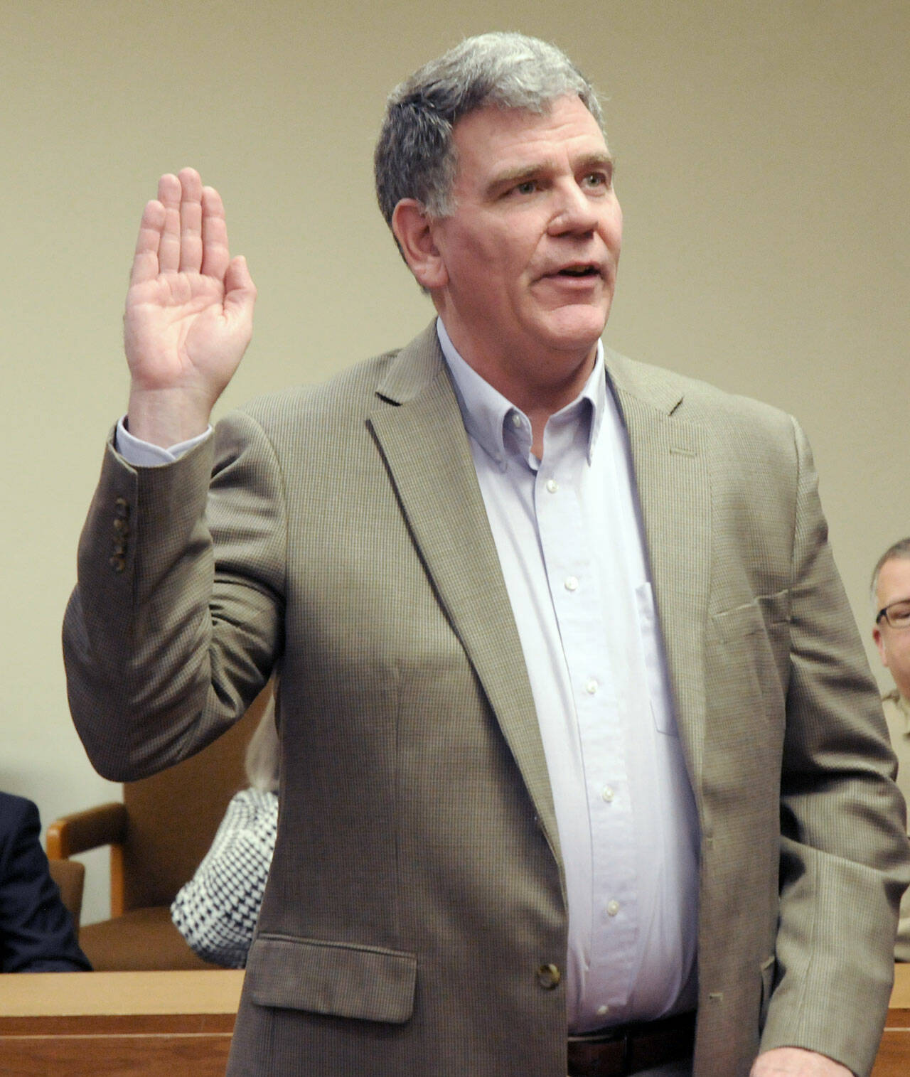 Bruce Emery takes the oath of office for the position of Clallam County director of community development on Wednesday. (Keith Thorpe/Peninsula Daily News)