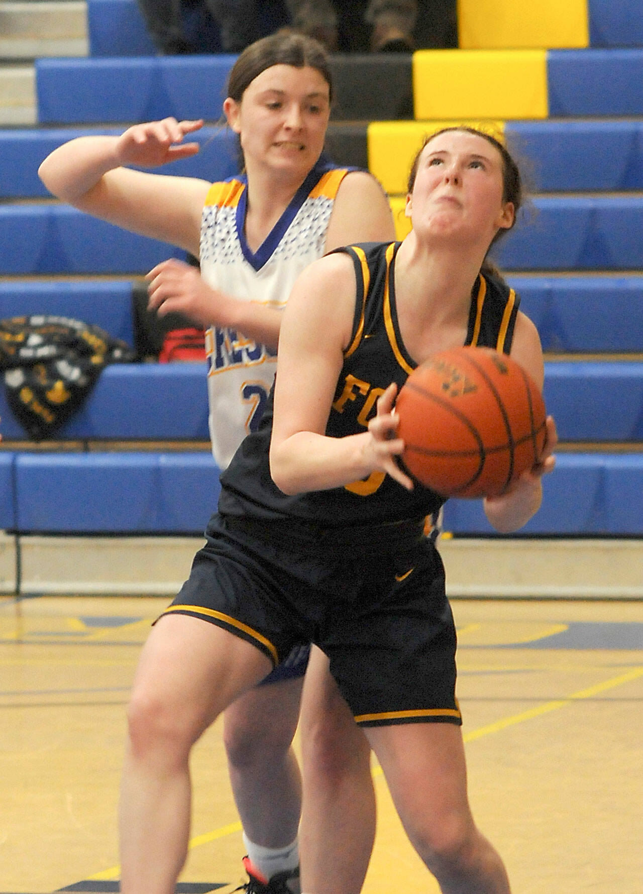Forks’ Keira Johnson looks for the hoop as Crescent’s Kaylen Mason tries to defend on Wednesday at Crescent High School. (Keith Thorpe/Peninsula Daily News)