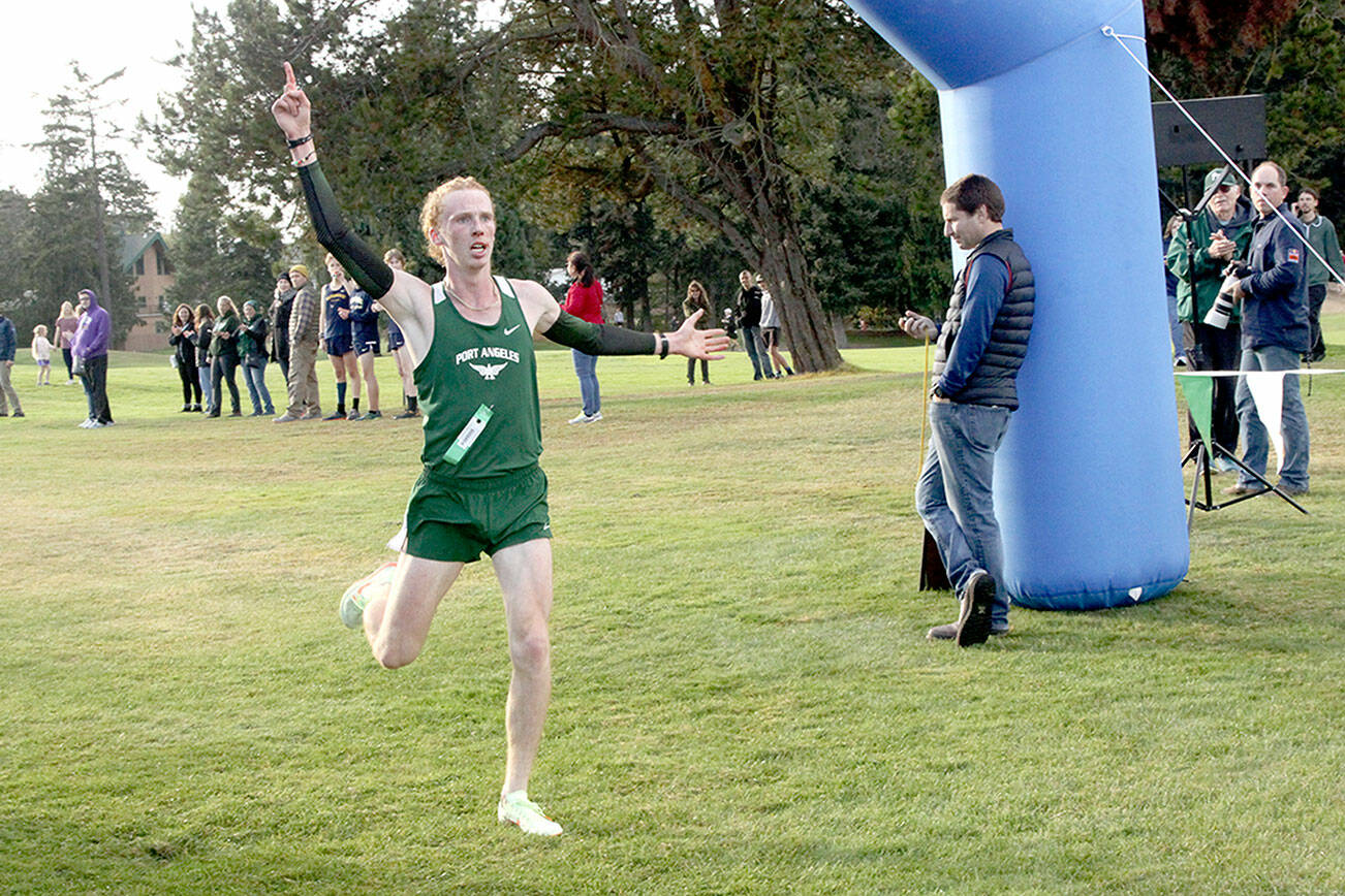 Dave Logan/for Peninsula Daily News
Jack Gladfelter, of Port Angeles wins the Olympic 2A League cross-country championship with a time of 15 minutes, 28 seconds at the Cedars at Dungeness.