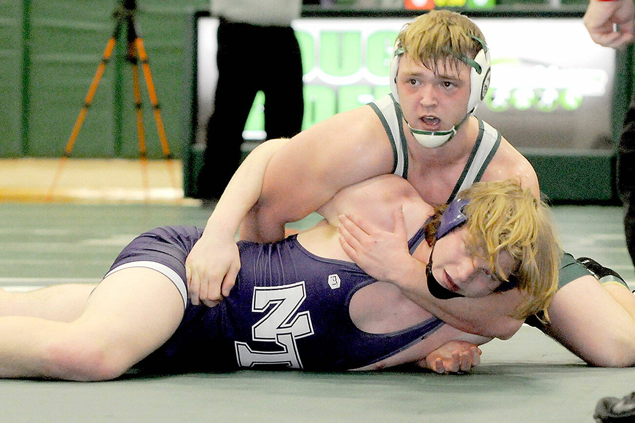 KEITH THORPE/PENINSULA DAILY NEWS
Thomas Arand of Port Angeles grapples with North Thurston's Sean Bures in the 195 lb. class on Saturday at Port Angeles High School.