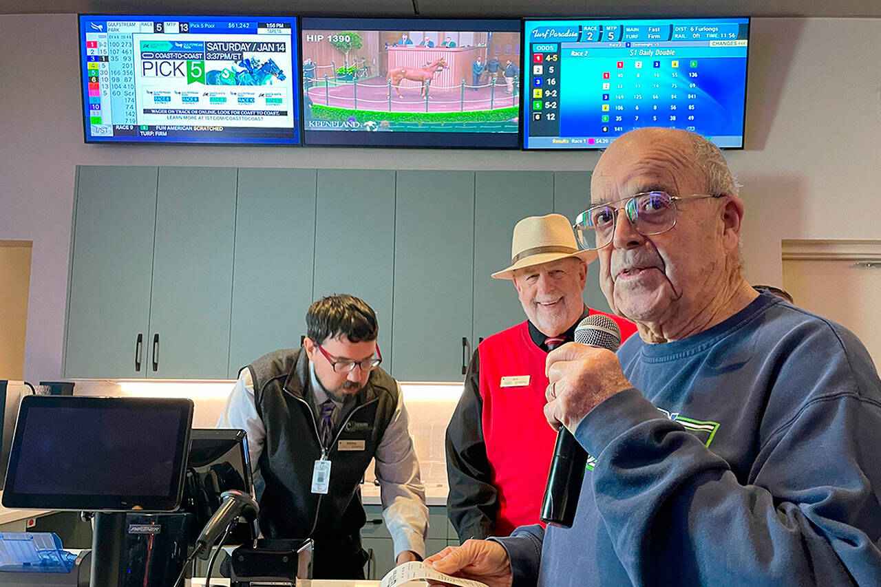 Howard “Scooter” Chapman makes the first bet at 7 Cedars Casino’s new Cedars Sportsbook at 270756 U.S. Highway 101 east of Sequim on Thursday. (Matthew Nash/Olympic Peninsula News Group)