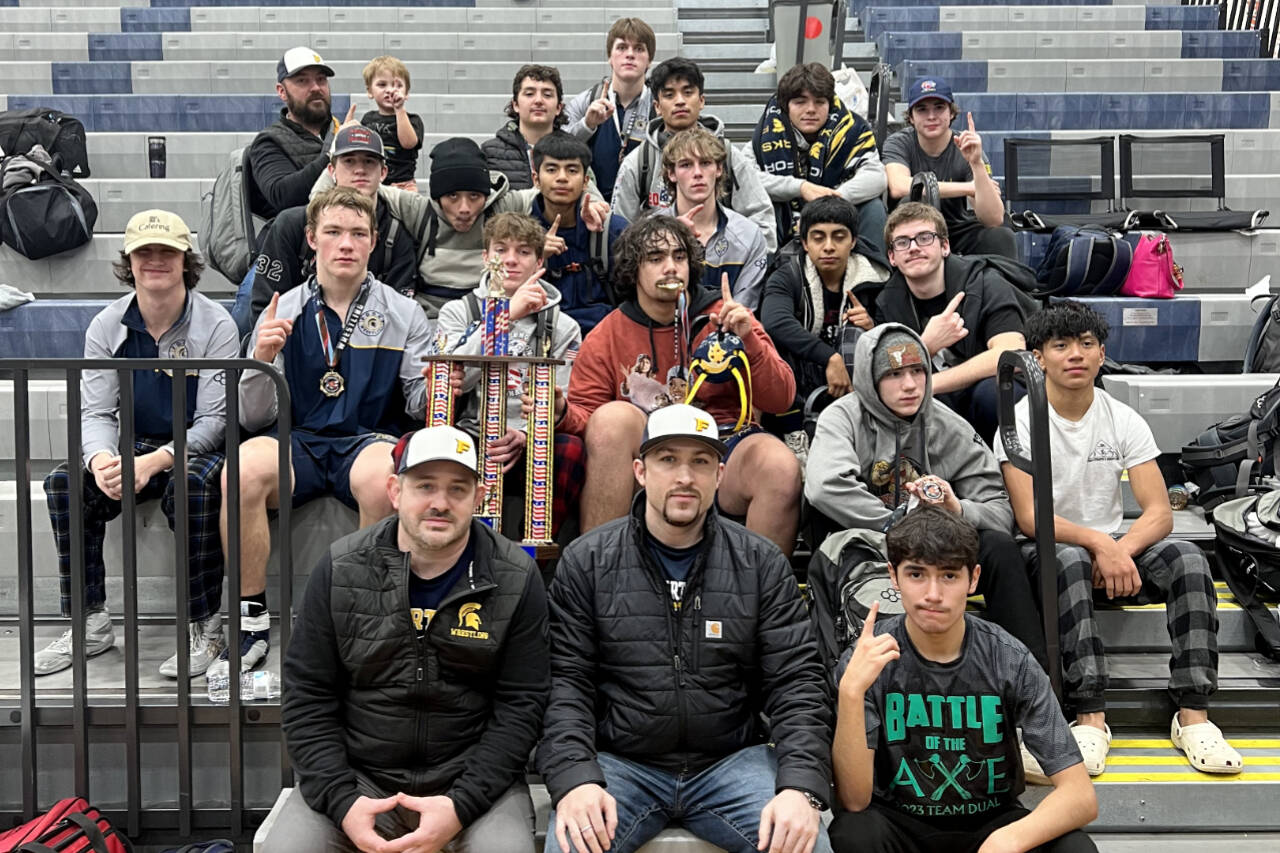 Courtesy photo
The Forks boys wrestling team celebrates its first-place finish at the Sgt. Justin Norton Memorial tournament held this weekend in Rainier. It is the second straight year the Spartans have won the tournament and it is the sixth tournament the boys have won this season.