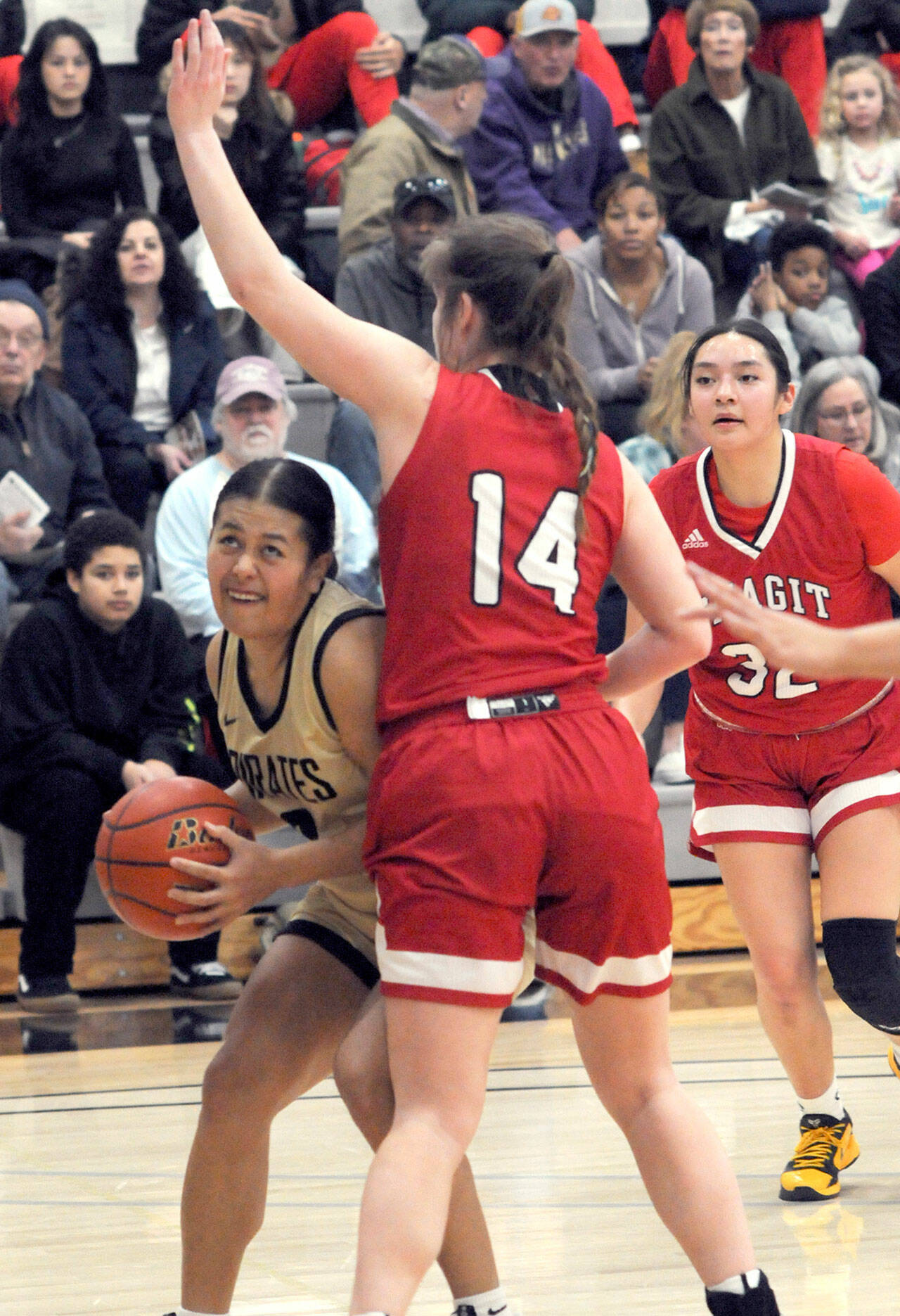 KEITH THORPE/PENINSULA DAILY NEWS
Peninsula's Tatianna Kaemae, left, tries to squeeze past Skagit Valley's Jenae Rhoads while Skagit's Sarah Cook, right, looks on during Wednesday night's conference game in Port Angeles.