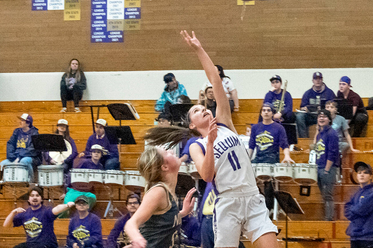 Emily Matthiessen /Olympic Peninsula News Group
Sequim's Taryn Johnson, right, looks to score in the Wolves' 64-49 home win over North Kitsap on Thursday.