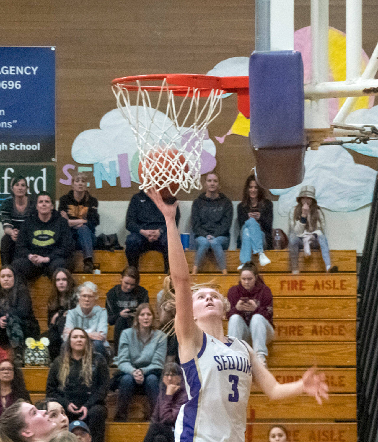 Emily Matthiessen /Olympic Peninsula News Group Sequim’s Jolene Vaara goes to the basket for two of her team-high 20 points in a 64-49 Olympic League win over North Kitsap on Thursday.