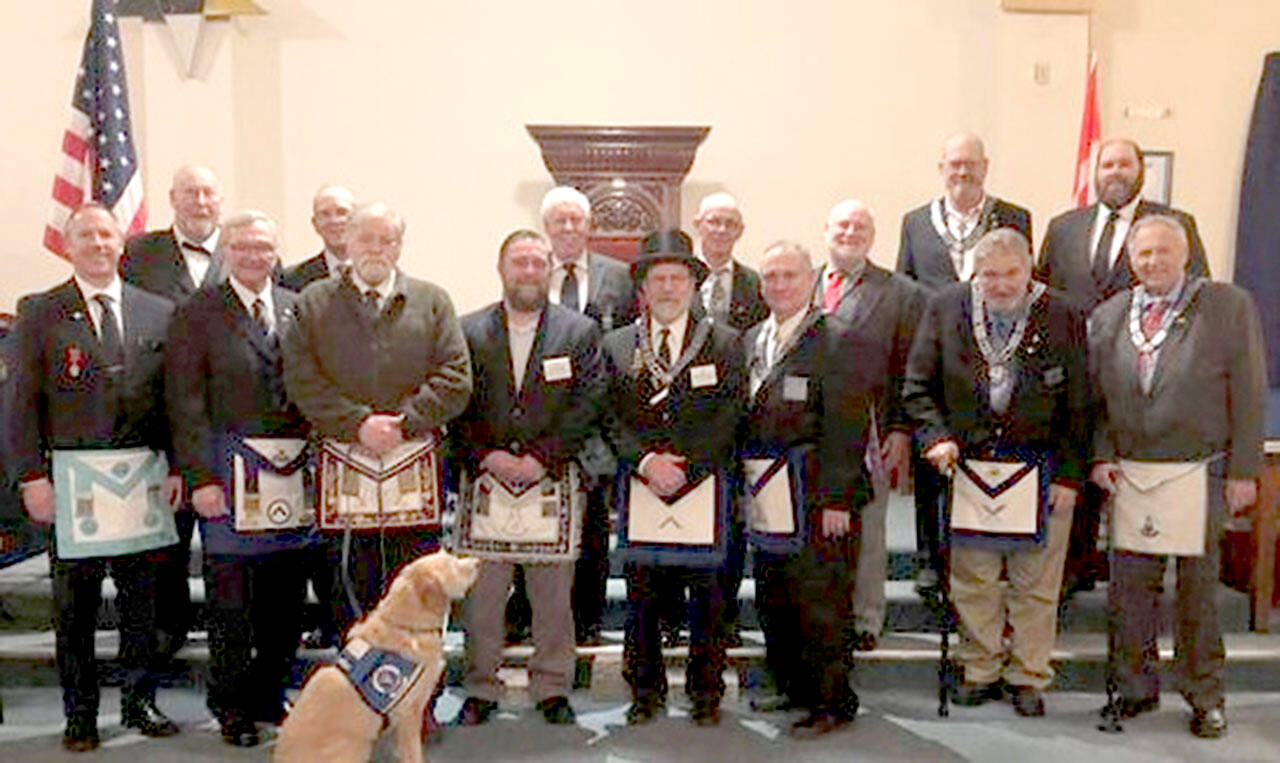 Pictured in the front row, from left to right, are Vance Smith, John Wylie, John Braasch, Gary Zambor, Pete Waldrip, Bob Caruthers, William Smith and Bob Wheeler. In the back row, from left to right: Arnie Finley, Winston Cardinez, Bob Jackson, William Schult, Michael Dew, Paul Carmean and Mike Sutherland. Sadie is in the foreground.