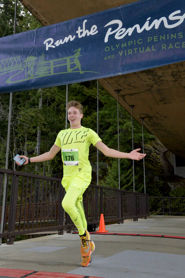 Sean Southard, 15, of Sequim crosses the finish line first in the 5K in the Elwha Bridge Run held Saturday west of Port Angeles. (Courtesy of Run the Peninsula)