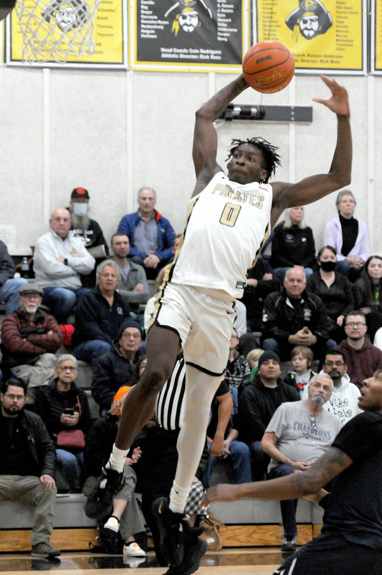 Peninsulas Ese Onakpoma goes up for the jam against Bellevue on Wednesday night in Port Angeles. (Keith Thorpe/Peninsula Daily News)