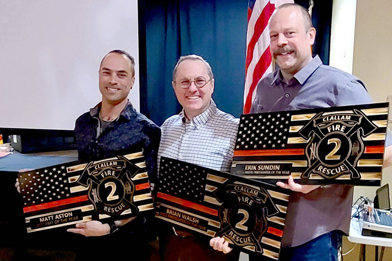 Clallam 2 Fire Rescue presented its annual awards for 2022 to, from left, Firefighter/EMT Matt Aston, Volunteer EMT of the Year; Firefighter/EMT Brian Walsh, Volunteer Firefighter of the Year; and Firefighter/paramedic Erik Sundin, Career Firefighter of the Year.