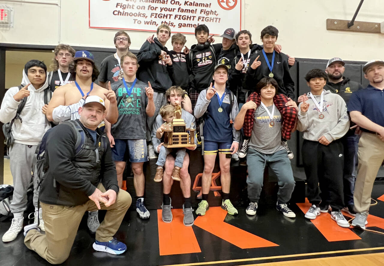 The Forks boys wrestling team celebrates its regional championship this weekend at Kalama High School. Forks goes into the Mat Classic this weekend as the No. 2-ranked 2B wrestling program in the state. (Courtesy of Forks wrestling)