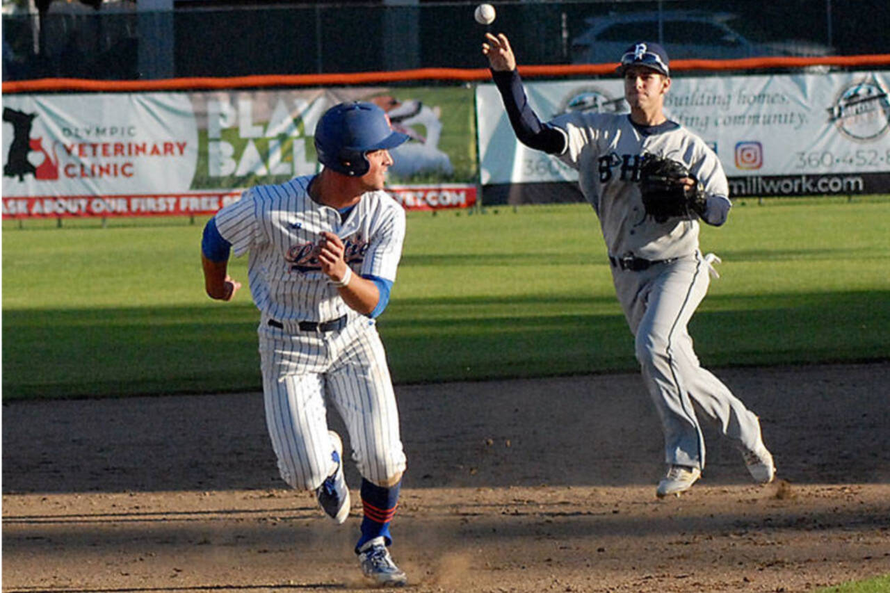 Damiano Palmegiani gets caught in a rundown at Civic Field during a game against Bellingham in 2019. Palmegiani, who is from Surrey, B.C., played 51 games for the Port Angeles Lefties, was picked by Team Canada to play in the World Baseball Classic later this summer. (Keith Thorpe/Peninsula Daily News)
