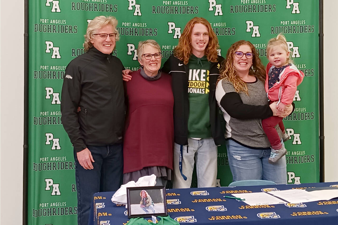 Jack Gladfelter celebrates his signing to run track and cross country at Corban University in Salem, Ore., with his, from left, father Joe Gladfelter, mother Becky Gladfelter, sister Jamie Pond and niece Wren Pond. (Pierre LaBossiere/Peninsula Daily News)