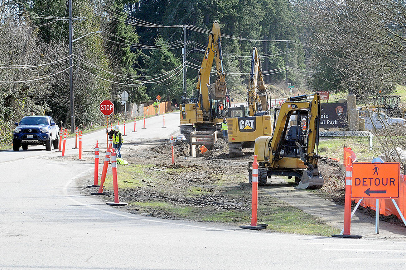 KEITH THORPE/PENINSULA DAILY NEWS
Excavators work along a section of Mount Angeles Road near the Olympic National Park visitor center on Thursday as part of a project to improve the Race Street corridor from Olympus Avenue to Eighth Street in Port Angeles. Phase one of the project, which will require occasional lane closures and detours, will include utility upgrades and isafety improvements for pedestrians, bicyclists, vehicles and transit users. Later phases of the project will extend from Eighth Street to the Port Angeles waterfront.