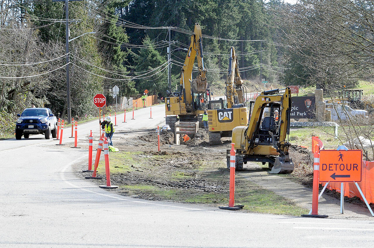 Excavators work along a section of Mount Angeles Road near the Olympic National Park visitor center on Thursday as part of a project to improve the Race Street corridor from Olympus Avenue to Eighth Street in Port Angeles. (KEITH THORPE/PENINSULA DAILY NEWS)