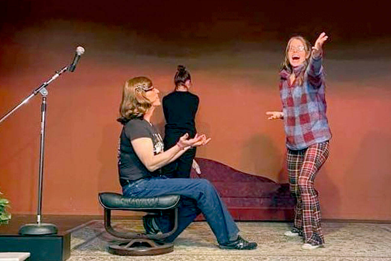 IWANT (Improv Without A Net Troupe) members, from left, Cat White, Kailey Droz, Lara Starcevich rehearse an improv game called Sit, Stand or Wall.